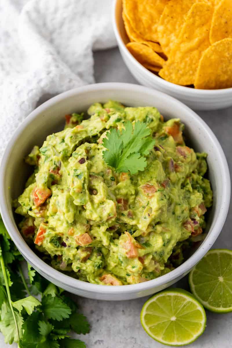 guacamole in a bowl with chips